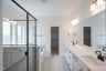 primary bathroom with soaking tub and walk-in shower