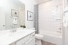 bathroom with white subway tile on shower wall