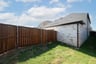 small yard with fence and grass 