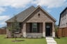 exterior of home with brown brick and white stone