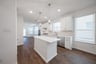 open kitchen with white cabinets