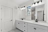 two large mirrors in the primary bath
