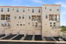 rear of building with one-car garages
