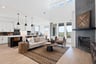 open great room with wood floors and tall ceilings