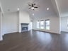open great room with wood floors and fireplace