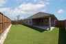 backyard with grass and covered patio