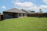 backyard with grass and covered patio