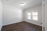 private study with wood floors and french doors