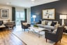 great room with a dark accent wall