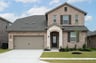 two-story home with brick and stone exterior