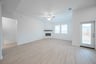 open great room with wood floors and fireplace