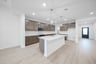 open kitchen with wood floors and island
