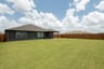 backyard with grass and covered patio