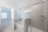 primary bathroom with soaking tub and walk-in shower