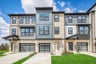 townhome exterior with a 1-car garage