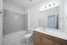 bathroom with tub and tile 