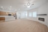great room with fireplace and wood flooring 