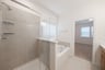 bathroom with walk-in shower and tub 