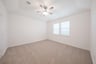 bedroom with carpet and ceiling fan 