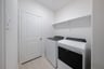 laundry room with included washer and dryer