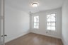 study with hardwood flooring and french doors