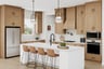 rendering of kitchen with wood-finish cabinets and white quartz counters