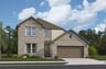home with brick, windows, garage and landscaped grass 