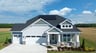 single-family home exterior with a 3-car garage and solar panels
