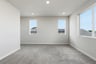 bedroom with gray carpet, three windows, and recessed ceiling lights