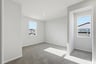 loft with gray carpet, window, and recessed ceiling light