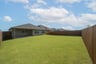 backyard with grass and covered patio