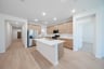 open kitchen with wood floors and island