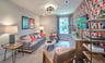 loft with a couch and two chairs