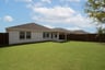 backyard with grass and covered patio