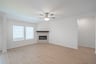 open great room with wood floors and fireplace