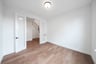private study with wood floors and french doors