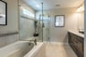 primary bath with a separate shower and soaking tub