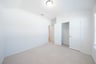 guest bedroom with carpet