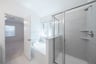 primary bathroom with soaking tub and shower