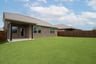 backyard with grass and covered patio