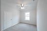 gameroom with carpet and ceiling fan