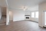 open great room with wood floors and fireplace