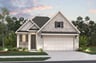 home with rock, window, garage and landscaping