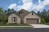 home with brick, windows, garage and landscaped grass 