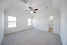 bedroom with carpet and ceiling fan 