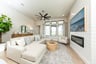 open great room with high ceilings and electric fireplace