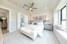 large primary bedroom with carpet