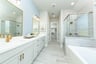 primary bathroom with soaking tub and shower