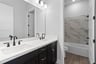 guest bathroom with double sinks