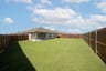 backyard with grass and covered patio